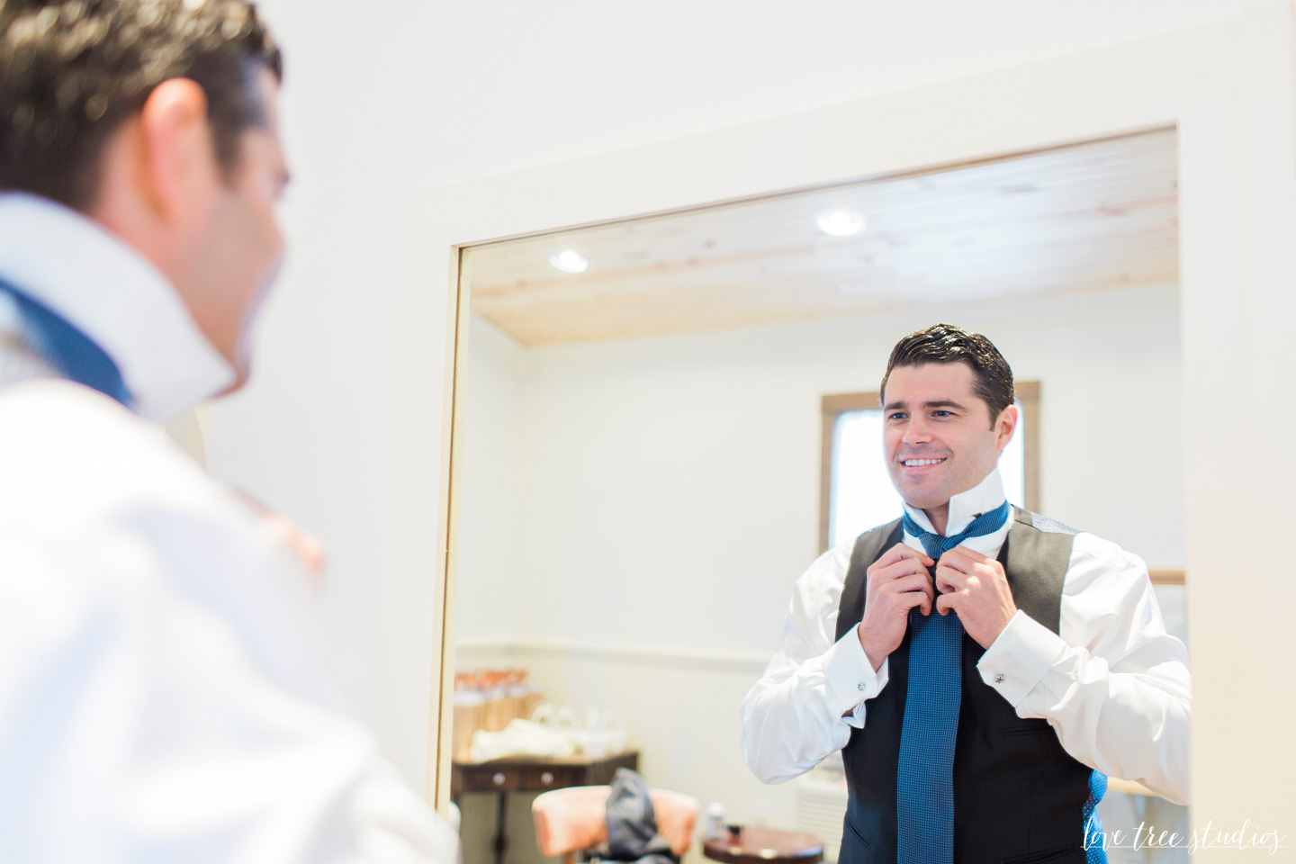 Groom dressing for wedding