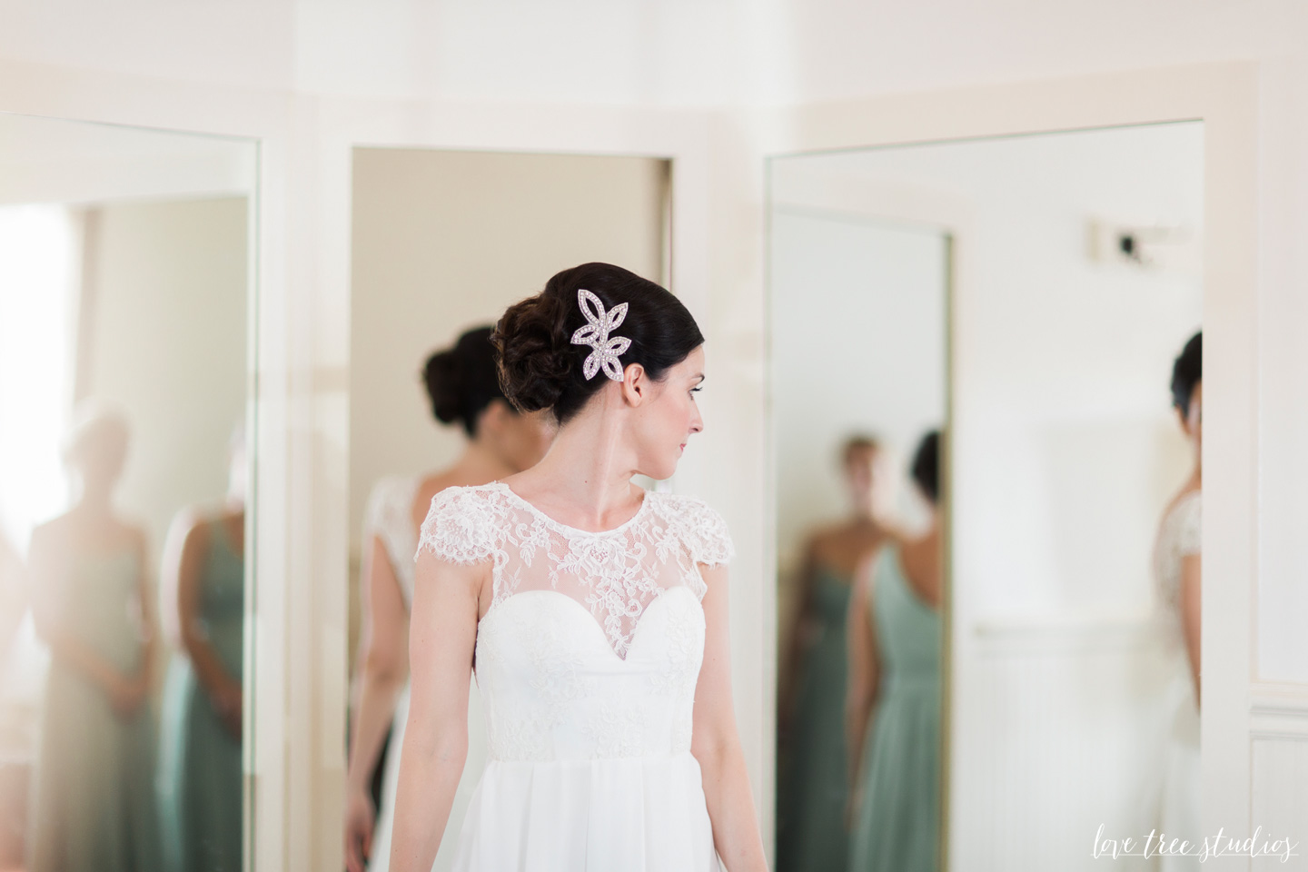 bride putting on wedding dress