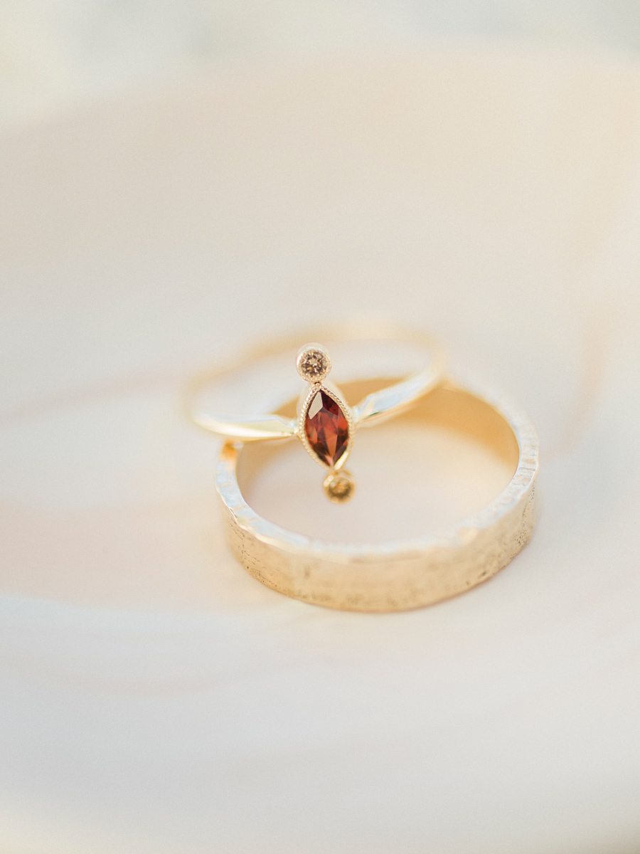 The Northway Studio handcrafted a dainty garnet wedding ring photographed by Missouri wedding photographer Love Tree Studios.