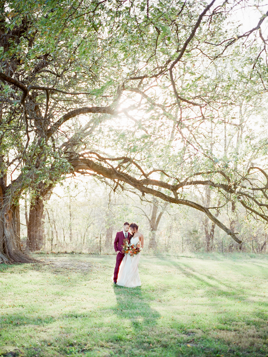 Fine art film wedding photographer captures the beautiful setting of a wedding at Blue Bell Farm in Columbia, Missouri.
