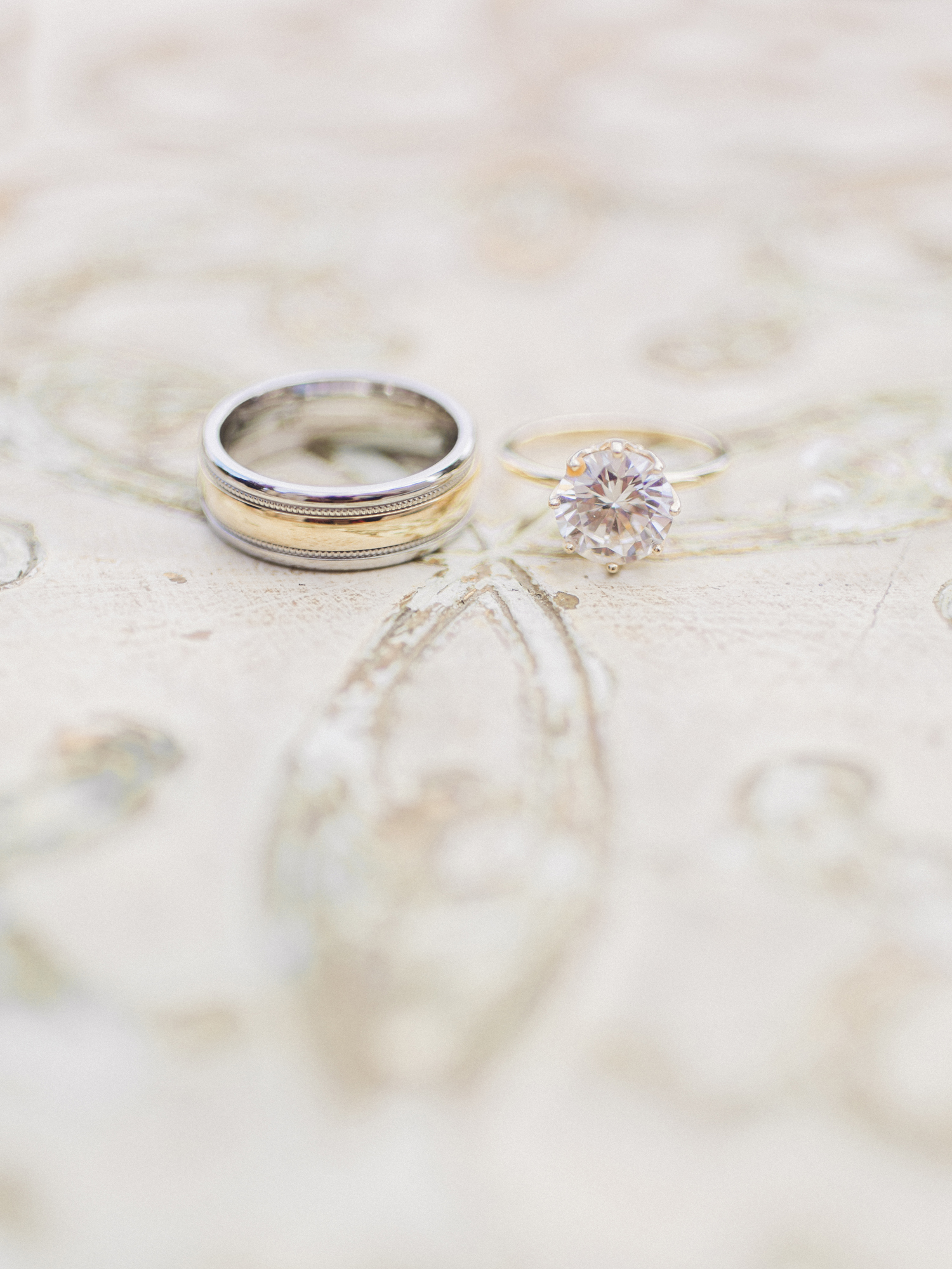 Gold solitaire engaement ring in a basket of diamonds by Lauren Priori Jewelery photographed by fine art wedding photographer Love Tree Studios in St. Louis Missouri.
