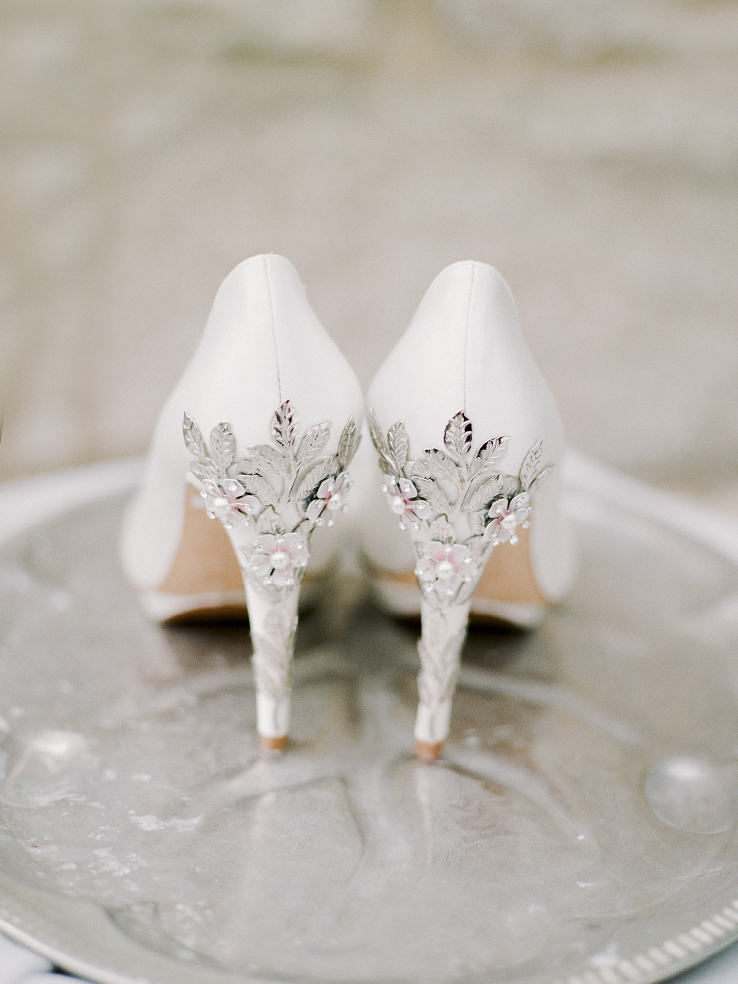 Missouri wedding photographer Love Tree Studios captures a detail of Harriet Wilde bridal shoes at Silver Oaks Chateau in St. Louis Missouri.