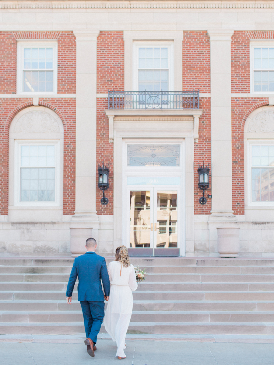 A couple prepares for their intimate courthouse wedding elopement in Columbia, Missouri by wedding photographer Love Tree Studios.