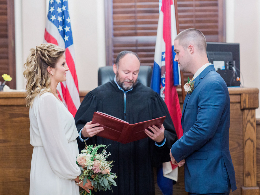 A couple weds in an intimate courthouse wedding ceremony at the Munical Courthouse in Columbia Missouri by photographer Love Tree Studios.