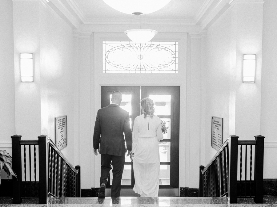 A couple weds in an intimate courthouse wedding ceremony at the Munical Courthouse in Columbia Missouri by photographer Love Tree Studios.