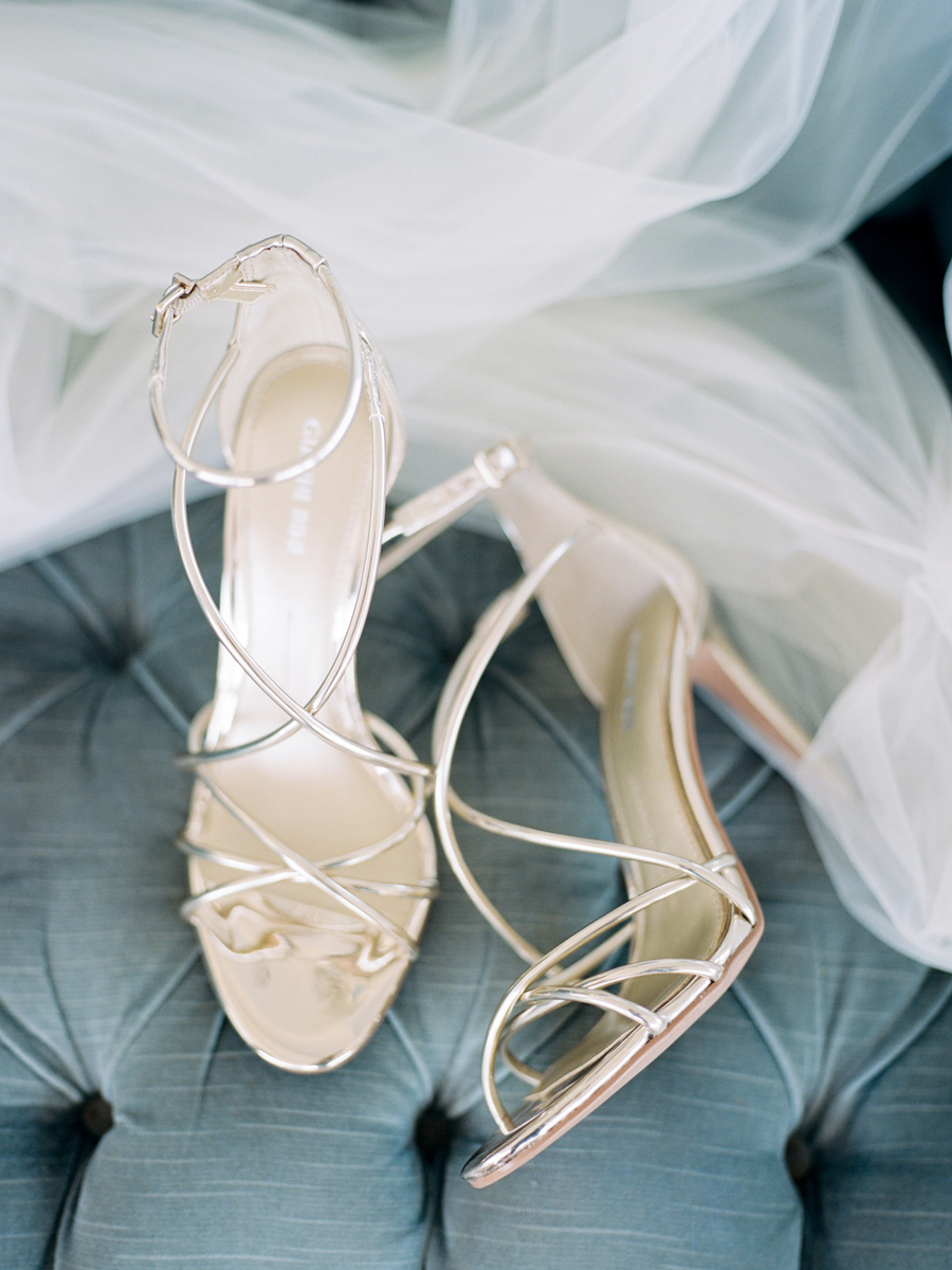 A detail photograph of the bride's Gianni Bini wedding shoes from Missouri wedding photographer Love Tree Studios.