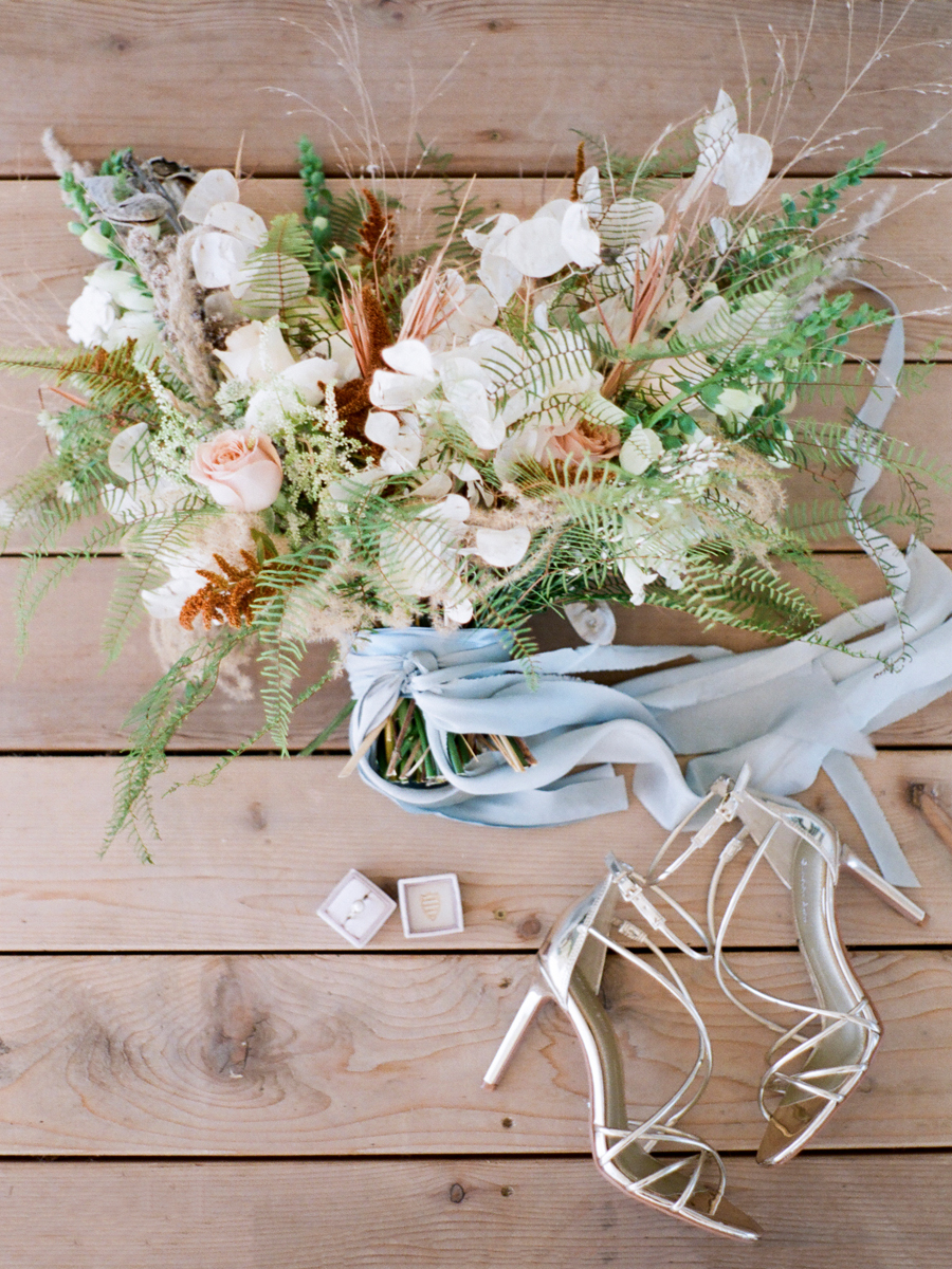 The bridal bouquet by Sugarberry Blooms at a Missouri wedding by photographer Love Tree Studios.