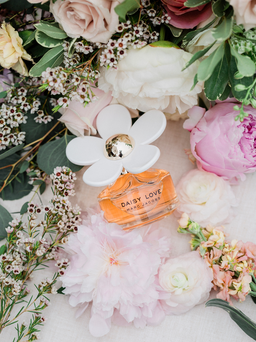 Wedding perfume set among flowers at Blue Bell Farm photographed by Love Tree Studios.