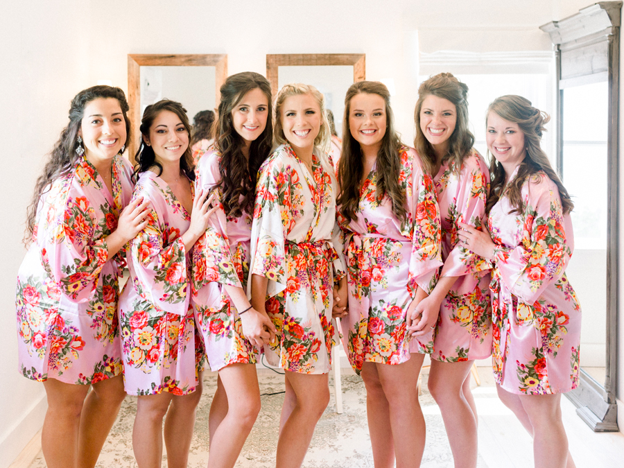 Bridesmaids pose in their robes before dressing for a wedding at Blue Bell Farm photographed by Love Tree Studios.