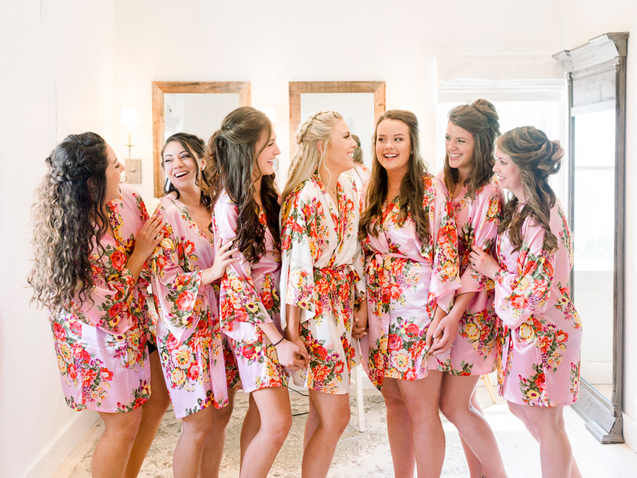 Bridesmaids pose in their robes before dressing for a wedding at Blue Bell Farm photographed by Love Tree Studios.