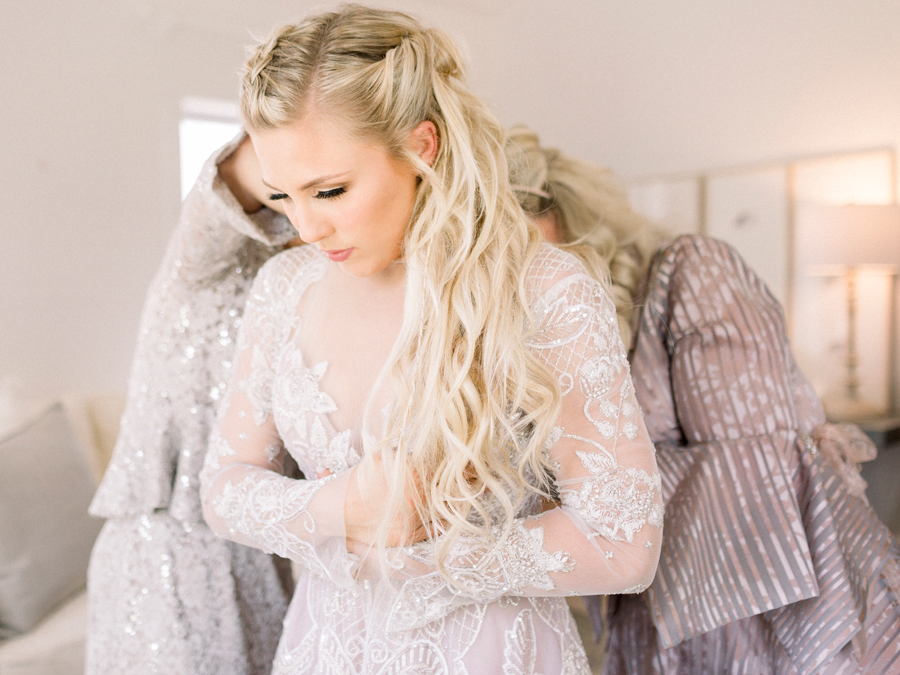 The bride gets ready for her wedding at Blue Bell Farm in Fayette, Missouri photographed by Love Tree Studios.