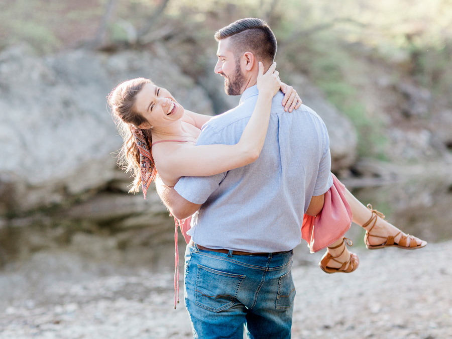 A sweet embrace at Capen Park during their engagement session by Missouri wedding photographer Love Tree Studios.