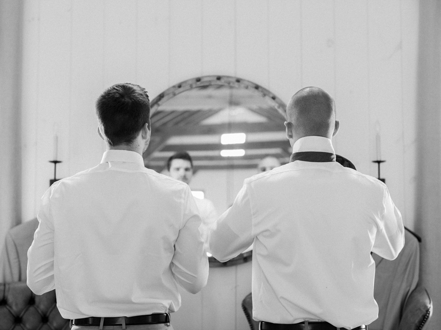 Love Tree Studios photographs a groom as he prepares for his wedding at Blue Bell Farm.