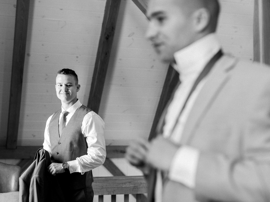 Love Tree Studios photographs a groom as he prepares for his wedding at Blue Bell Farm.
