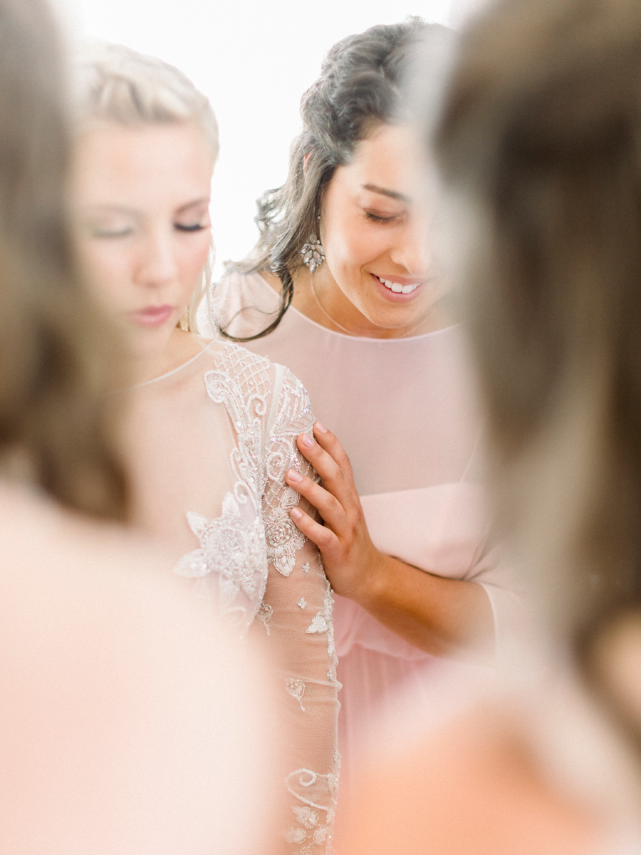 The bride gets ready for her wedding at Blue Bell Farm in Fayette, Missouri photographed by Love Tree Studios.