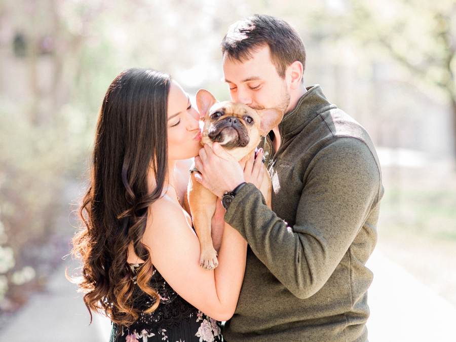 During their Columbia Missouri engagement session, the couple poses with their frenchie.