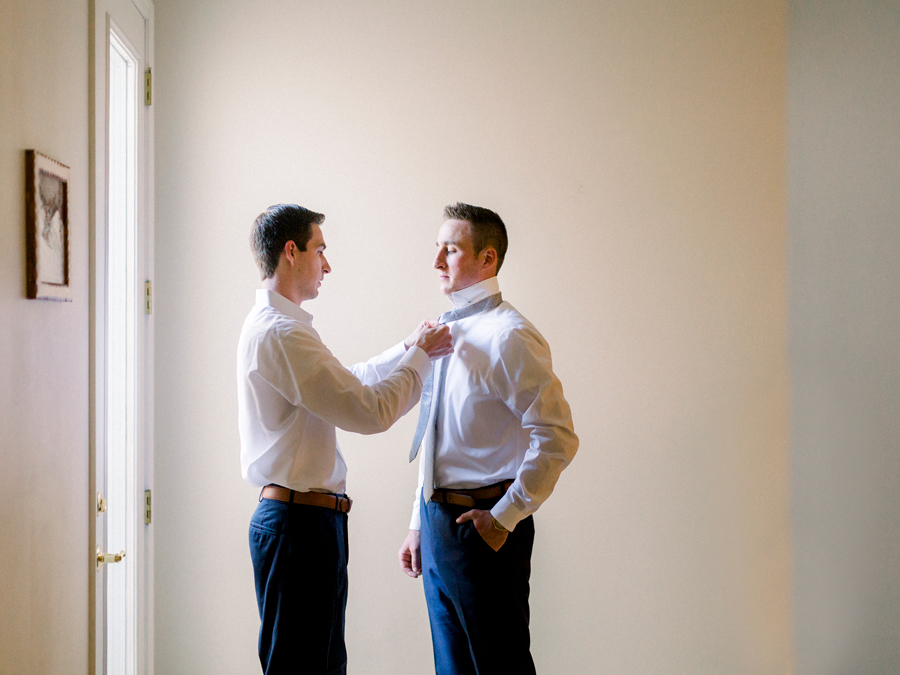 A groom gets ready for his Columbia Missouri wedding by Love Tree Studios.