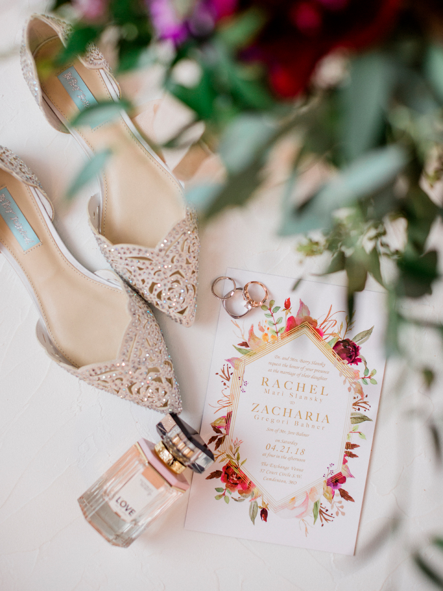 Betsy Johnson wedding shoes and Victoria's Secret Love perfume styled with a wedding suite designed by The Ink Cafe and photographed by Love Tree Studios at a camdenton missouri wedding.