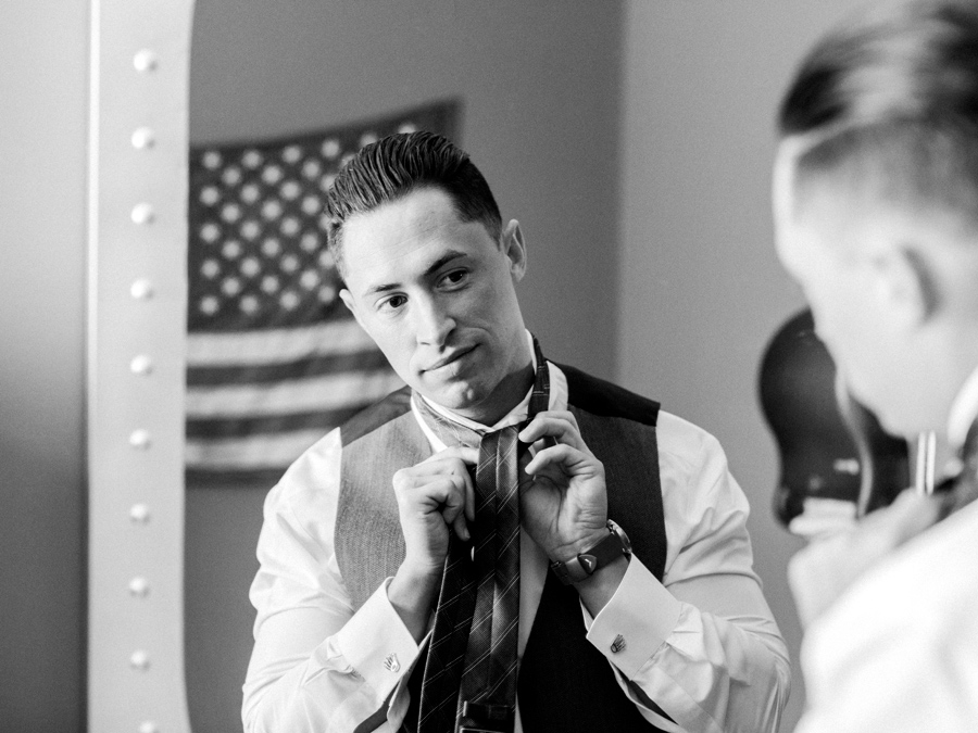 A groom preps for his wedding at The Exchange Venue by photographer Love Tree Studios at his Camdenton Missouri wedding.