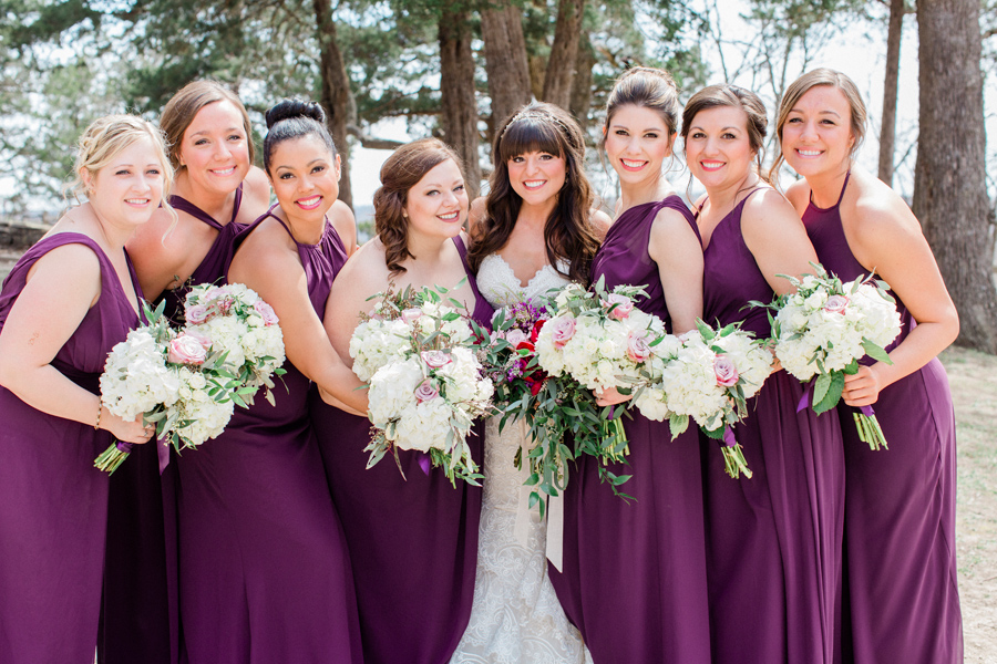The bride poses with her bridesmaids at Ha Ha Tonka State Park with wedding photographer Love Tree Studios for a Camdenton Missouri wedding.
