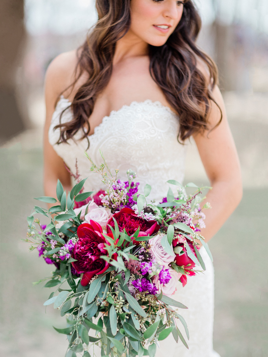 The bride poses with her bouquet for a bridal portrait by fine art wedding photographer Love Tree Studios at Ha Ha Tonka State Park for a Camdenton Missouri wedding.