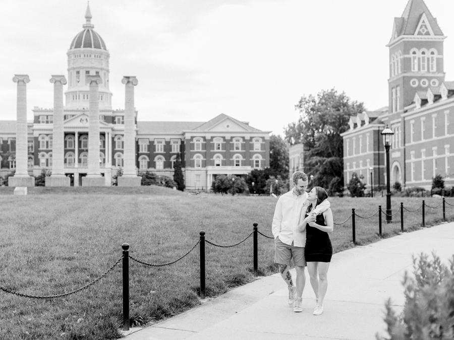 Walking on the University of Missouri's Quad, a couple looks lovingly at each other.