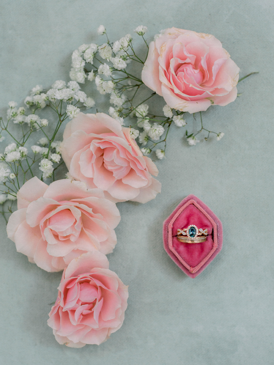 The bride's rings surrounded by rosebuds at a Blue Bell Farm wedding by Love Tree Studios.