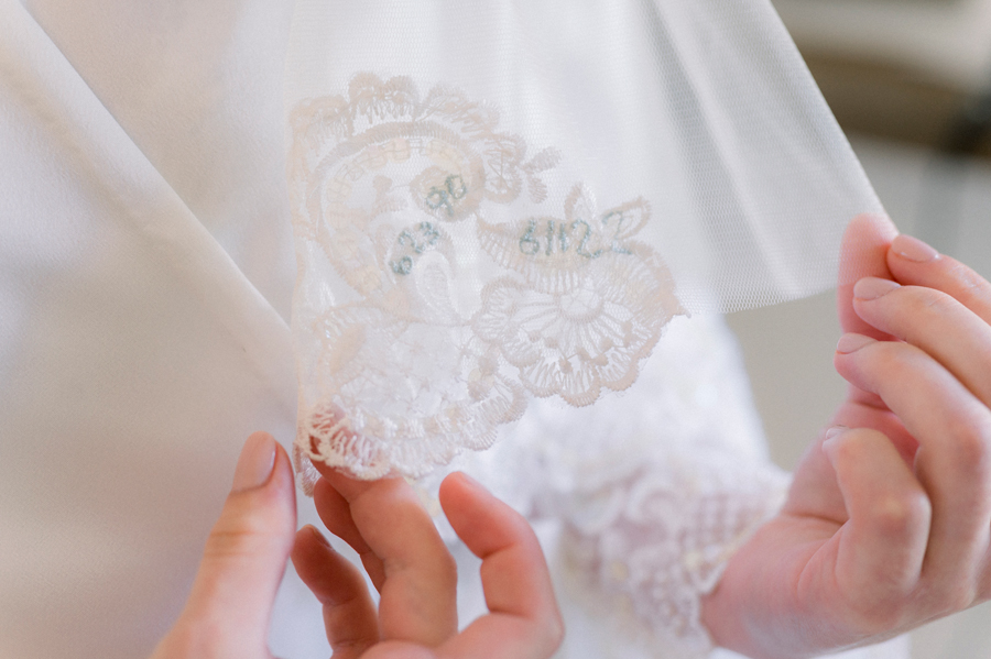 A close up of the bride's veil displaying hand stitched details at a Blue Bell Farm wedding by Love Tree Studios.