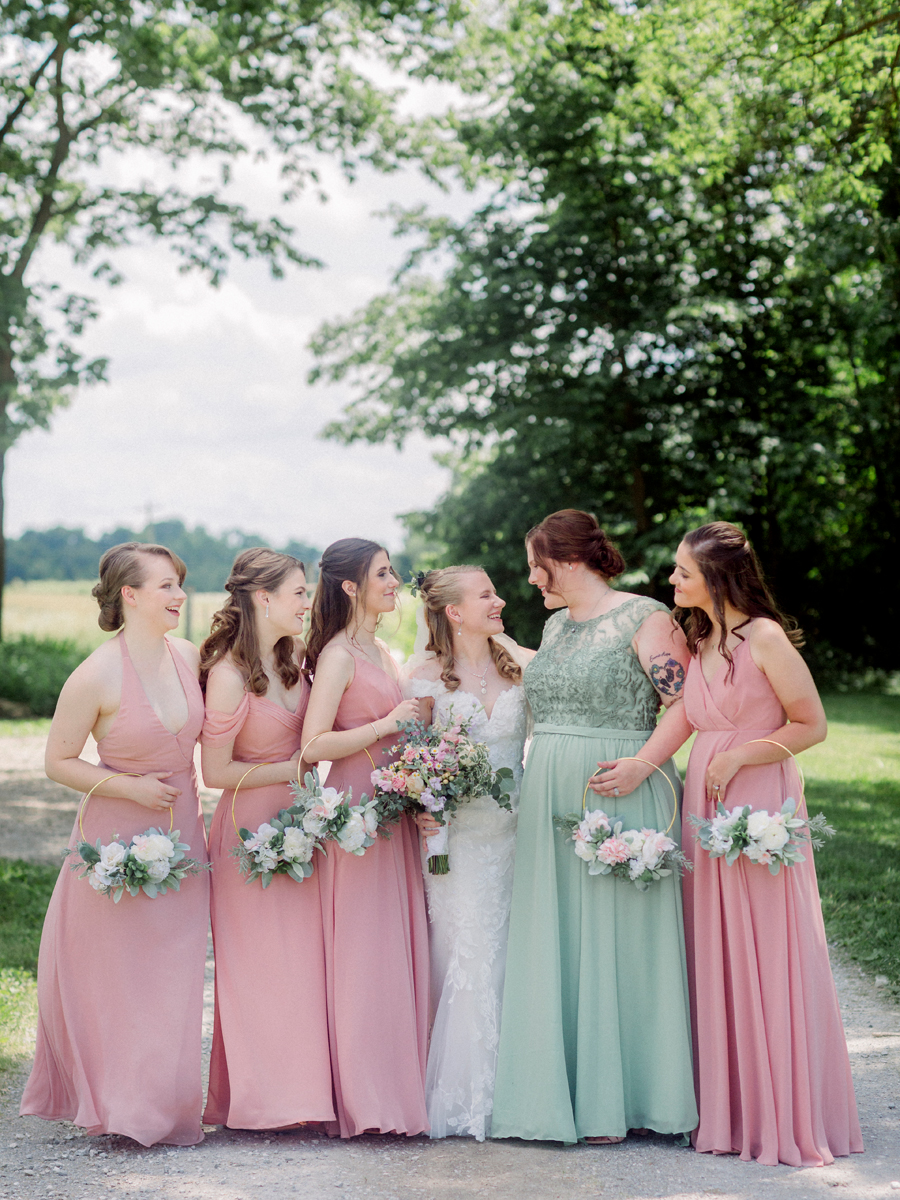 Bridesmaids laugh together at a Blue Bell Farm wedding by Love Tree Studios.