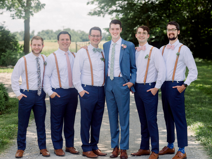 The groomsmen pose together at a Blue Bell Farm wedding by Love Tree Studios.