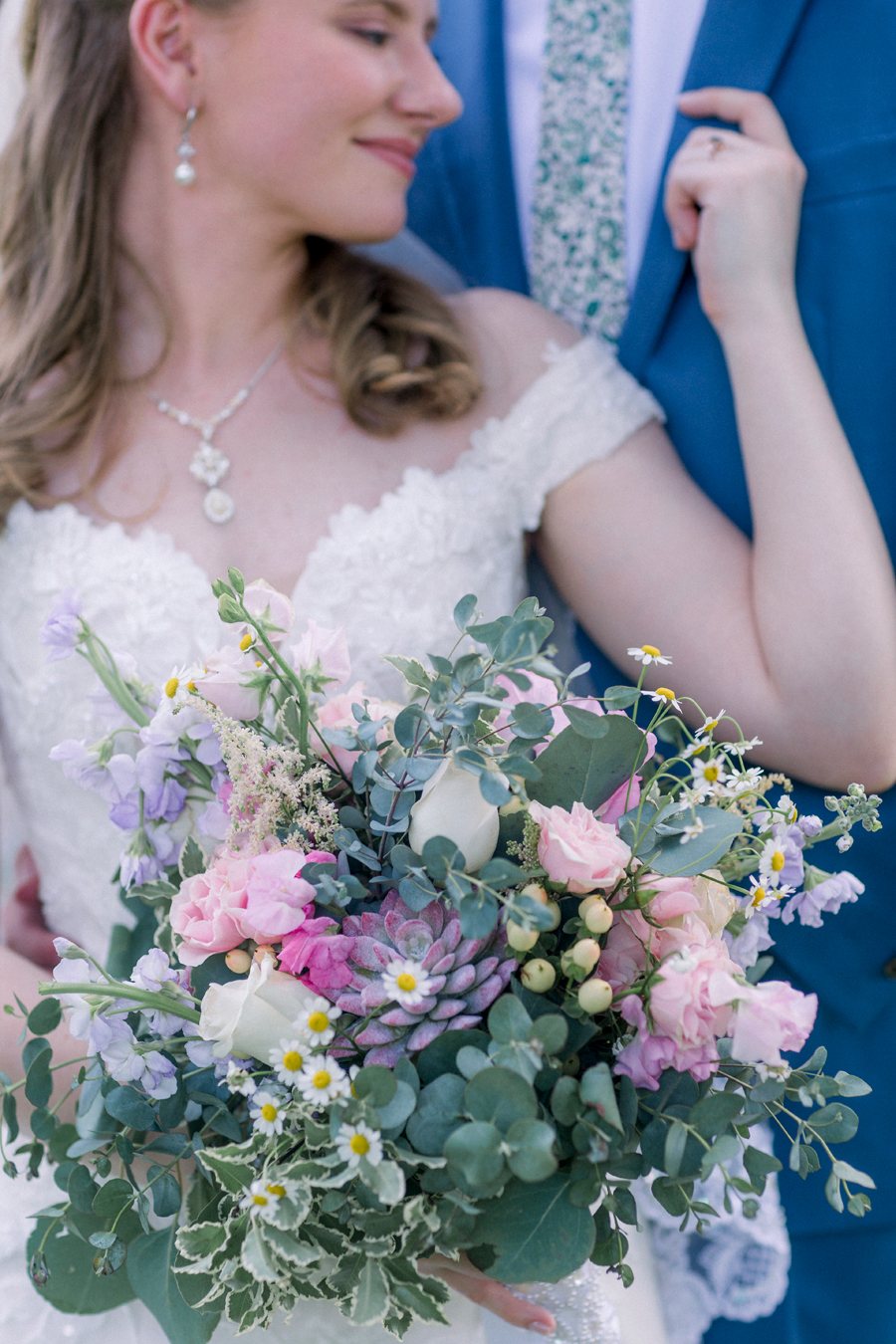 The bride's bouquet is shown in detail at a Blue Bell Farm wedding by Love Tree Studios.