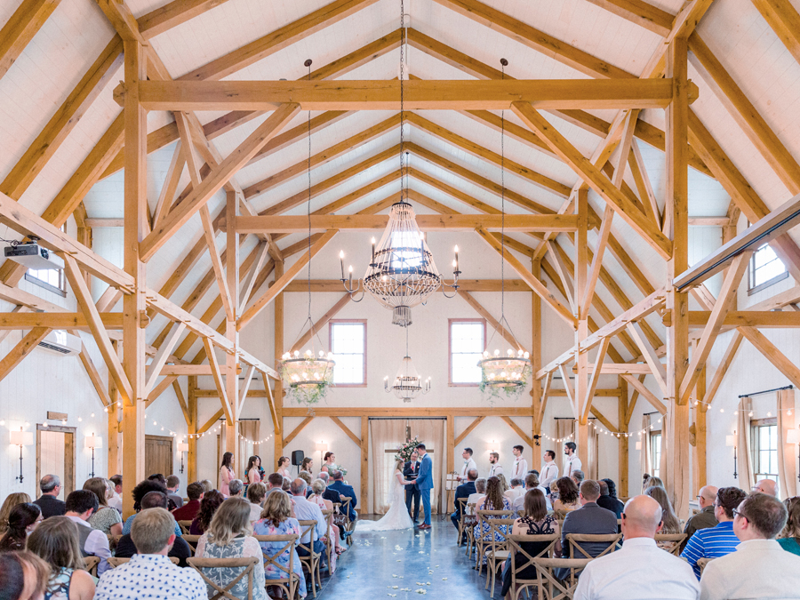 An inside photo of the barn at a Blue Bell Farm wedding by Love Tree Studios.