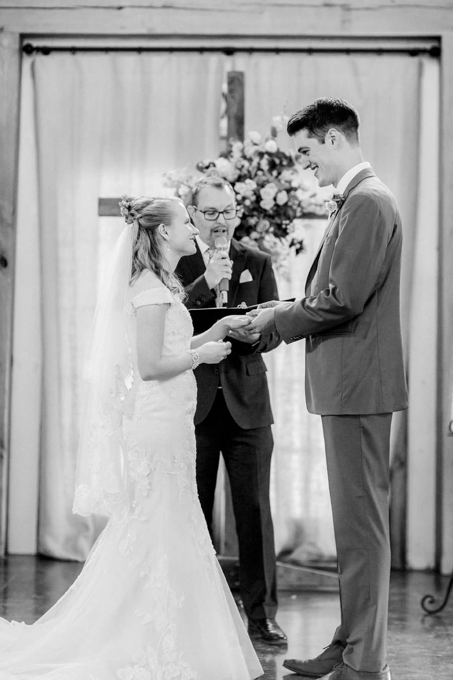 The bride and groom exchange vows at a Blue Bell Farm wedding by Love Tree Studios.