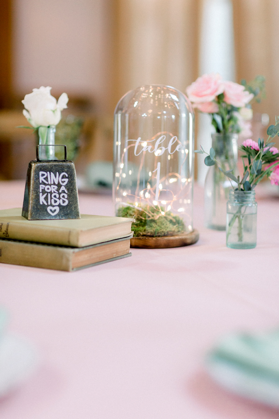 A photo of reception table decorations at a Blue Bell Farm wedding by Love Tree Studios.