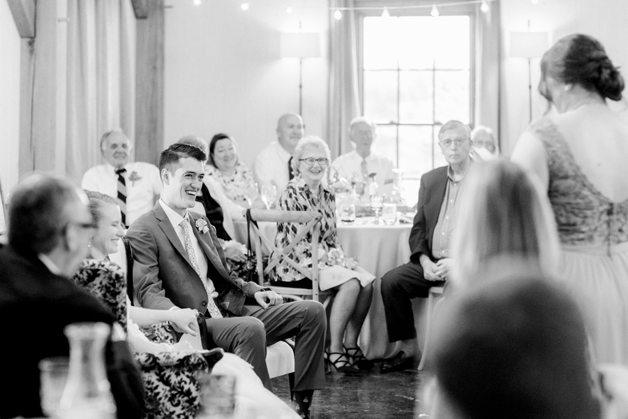 Guests watch as the maid of honor toasts the couple at a Blue Bell Farm wedding by Love Tree Studios.