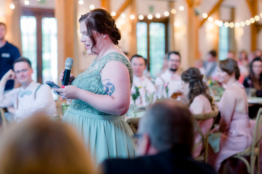The maid of honor gives a toast during the reception at a Blue Bell Farm wedding by Love Tree Studios.