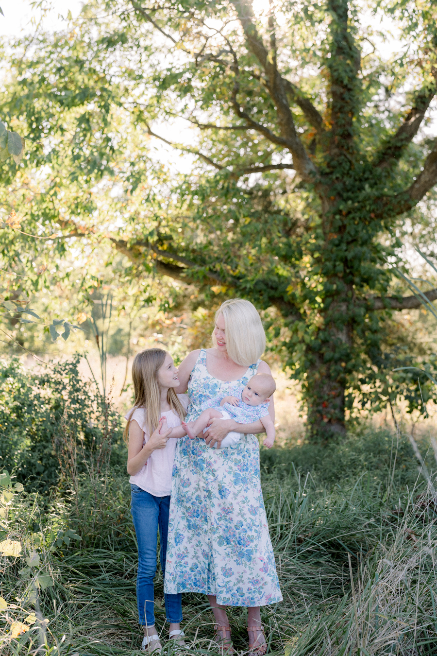 Three generations of daughters pose together for their Fayette Missouri family photography session by Love Tree Studios.