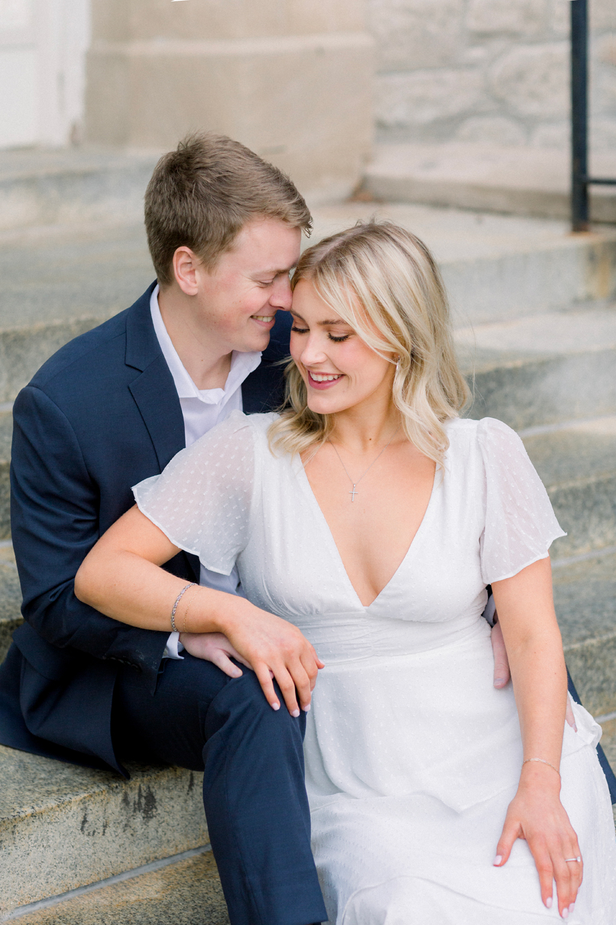 A couple takes photos on Mizzou Campus for their engagement session in downtown Columbia, Missouri by Love Tree Studios.