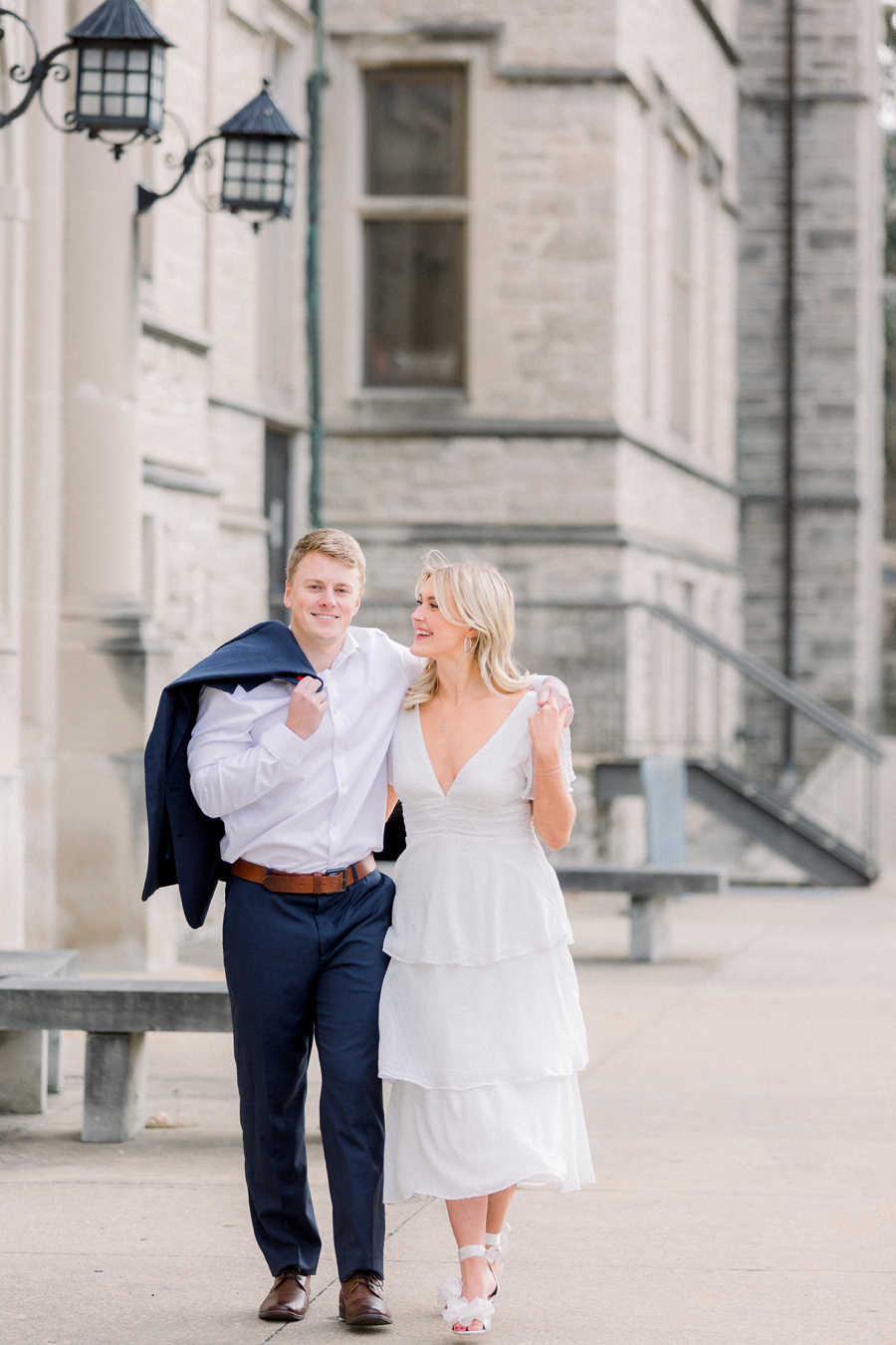 A couple takes photos on Mizzou Campus for their engagement session in downtown Columbia, Missouri by Love Tree Studios.