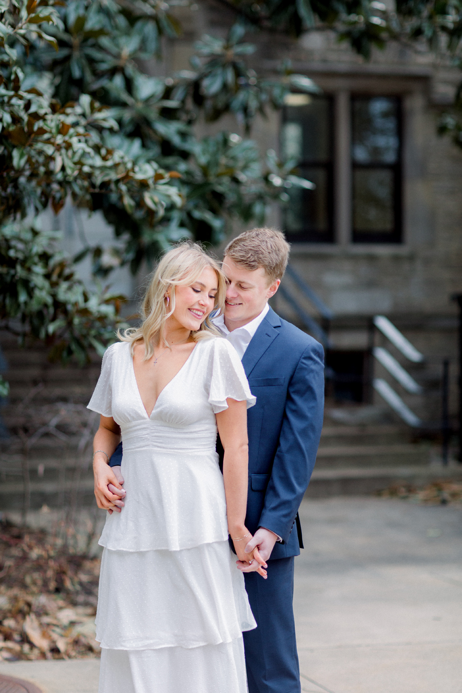 A couple takes photos on Mizzou Campus for their engagement session in downtown Columbia, Missouri by Love Tree Studios.