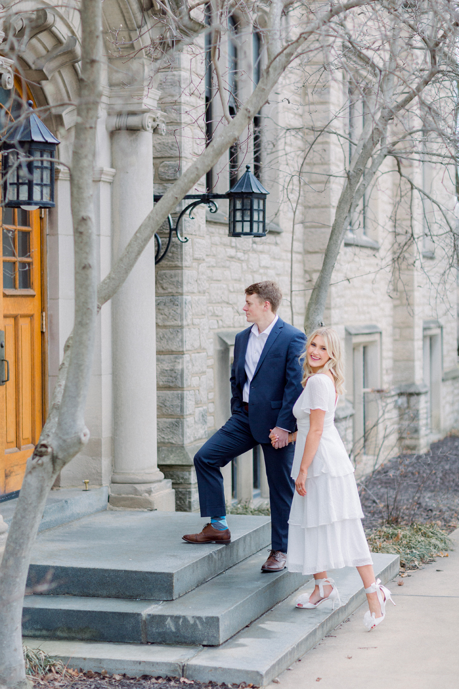 A couple takes photos on Mizzou Campus for their engagement session in downtown Columbia, Missouri by Love Tree Studios.