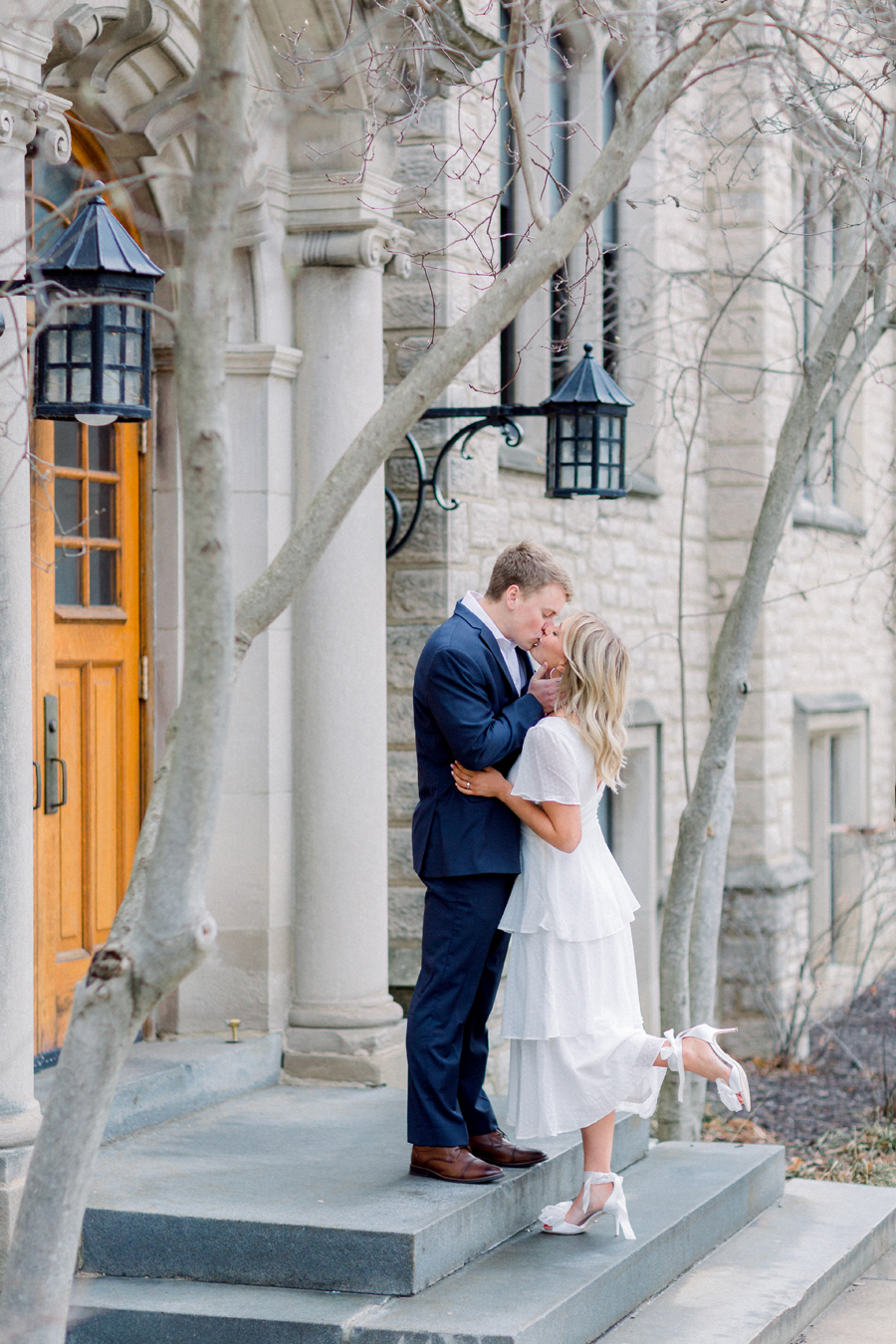 A couple takes photos on Mizzou Campus for their engagement session in downtown Columbia, Missouri by Love Tree Studios.