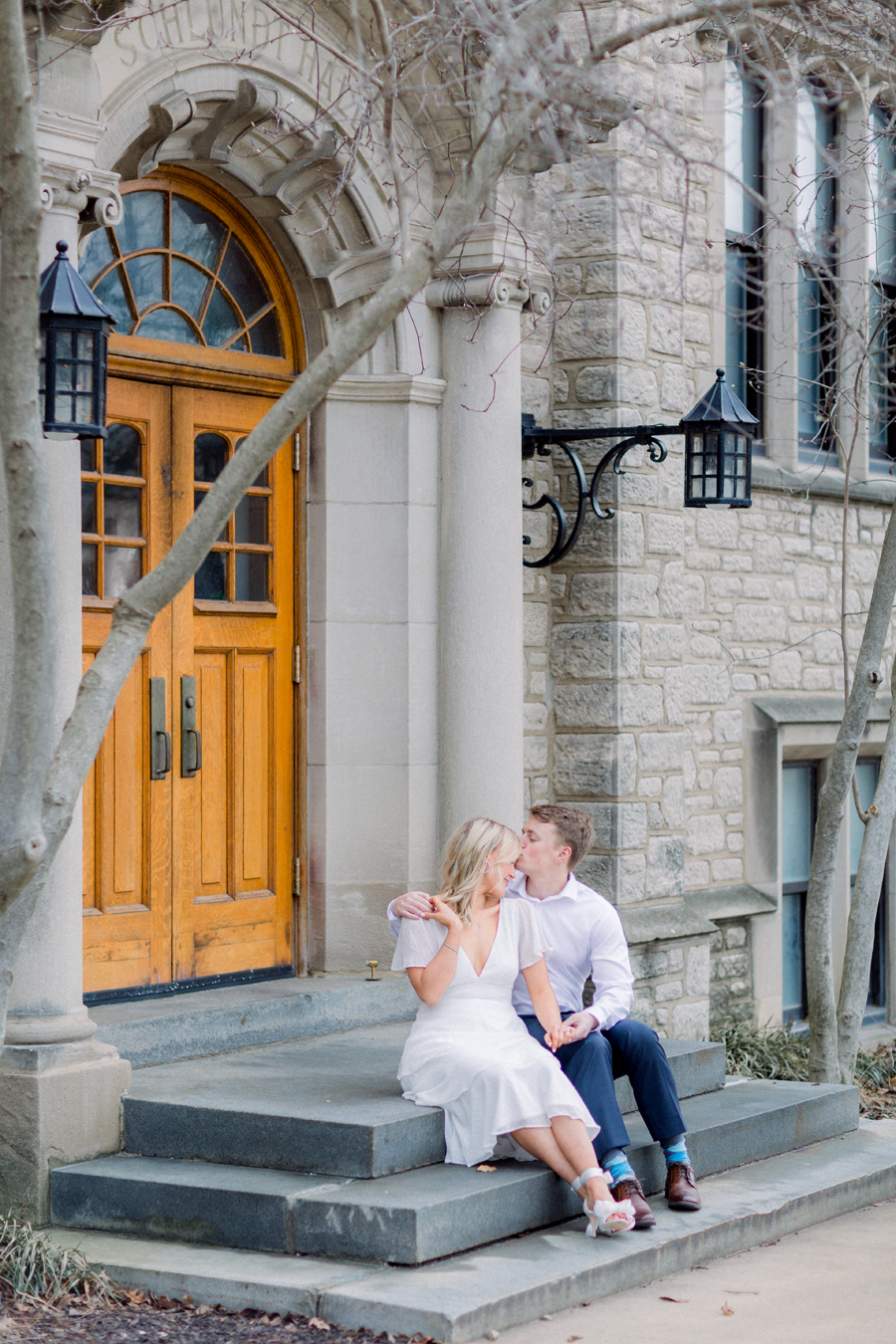 A couple takes photos on Mizzou Campus for their engagement session in downtown Columbia, Missouri by Love Tree Studios.
