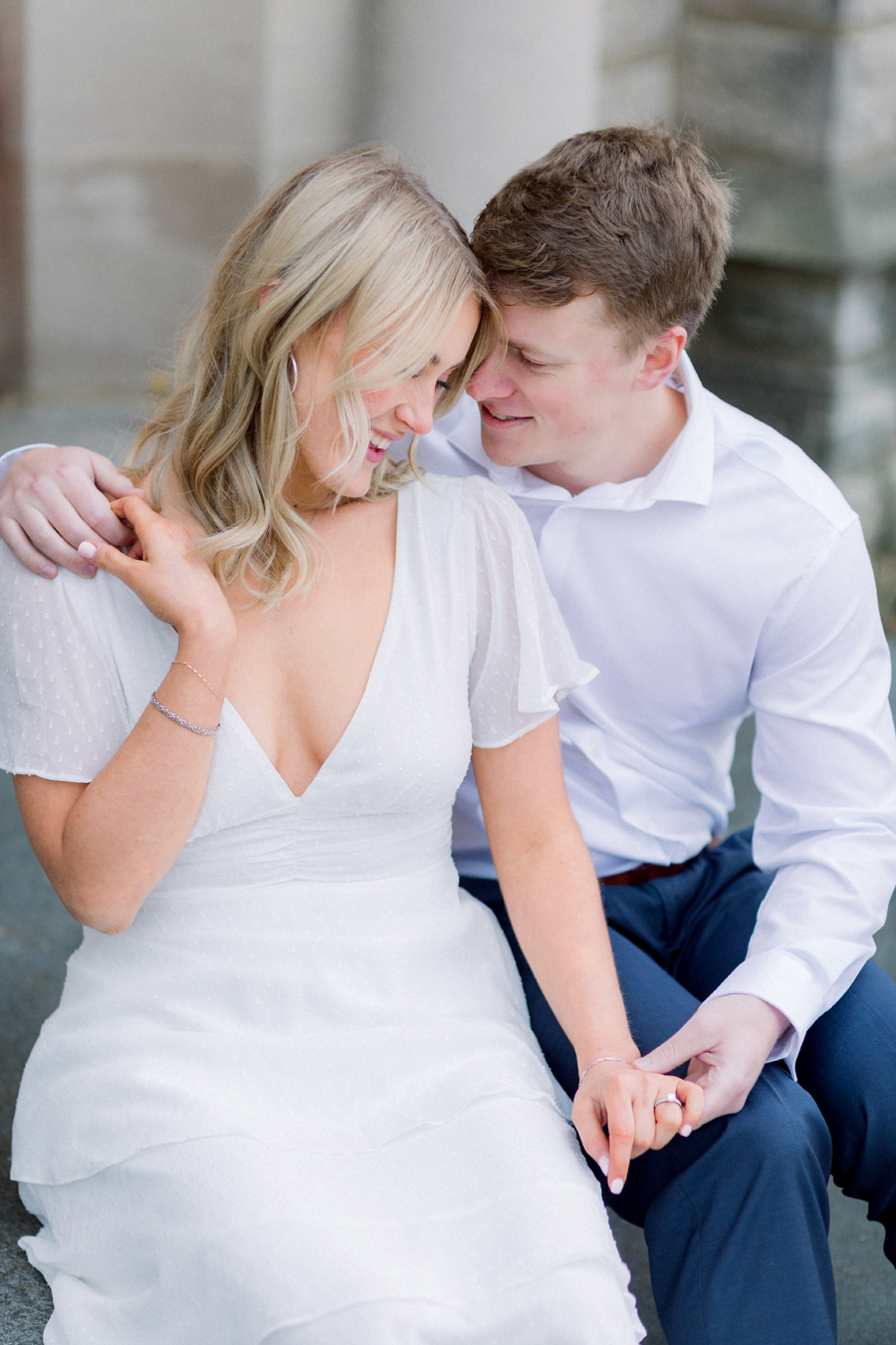 A couple takes photos on Mizzou Campus for their engagement session in downtown Columbia, Missouri by Love Tree Studios.