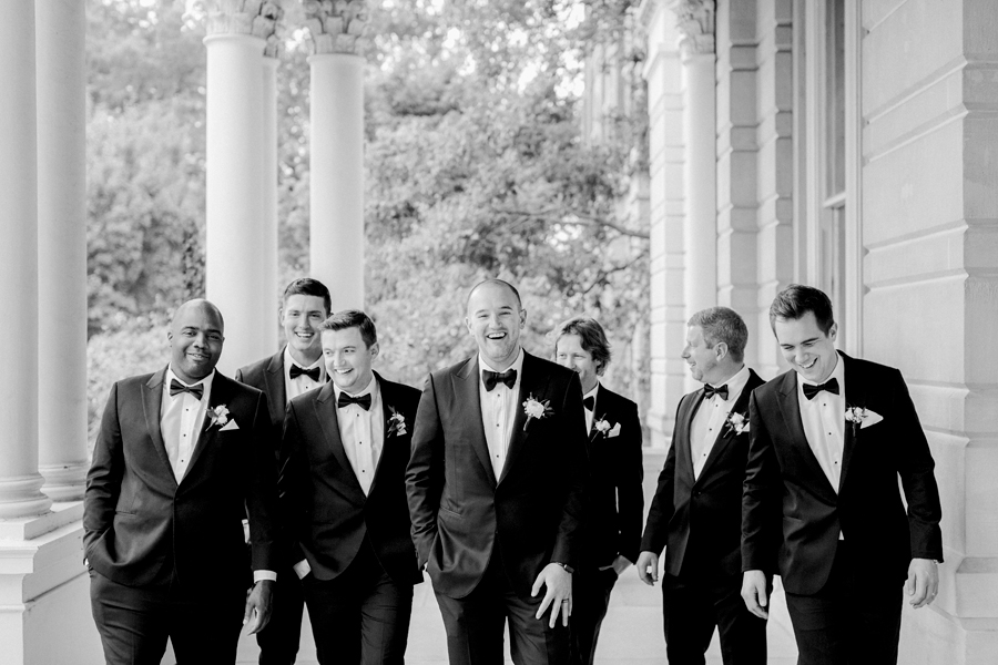 A groom poses with his groomsmen on the University of Missouri's campus for his Stephens College wedding photographed by Columbia, Missouri wedding photographer Love Tree Studios.