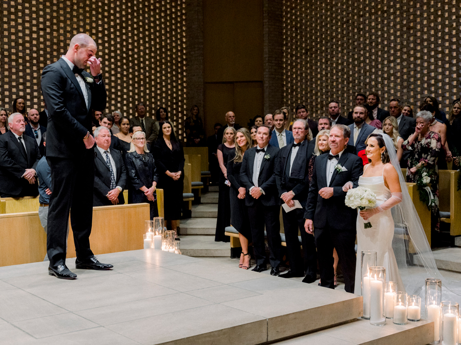 A walks down the aisle in Firestone Baars Chapel for her Stephens College wedding photographed by Columbia, Missouri wedding photographer Love Tree Studios.