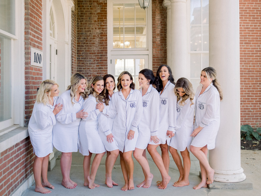 A bride poses with her bridesmaids before her Stephens College wedding photographed by Columbia, Missouri wedding photographer Love Tree Studios.