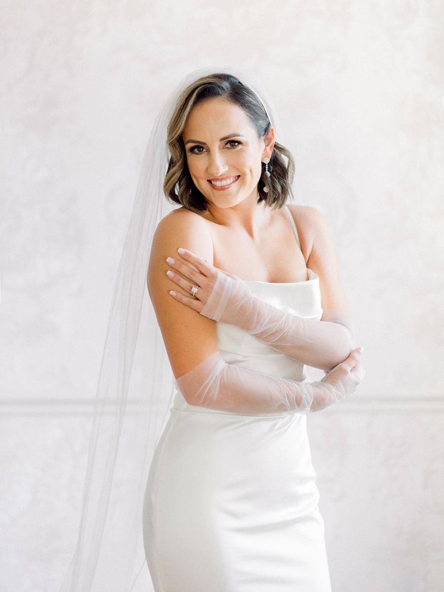 A bride poses for a portrait before her Stephens College wedding photographed by St. Louis, Missouri wedding photographer Love Tree Studios.
