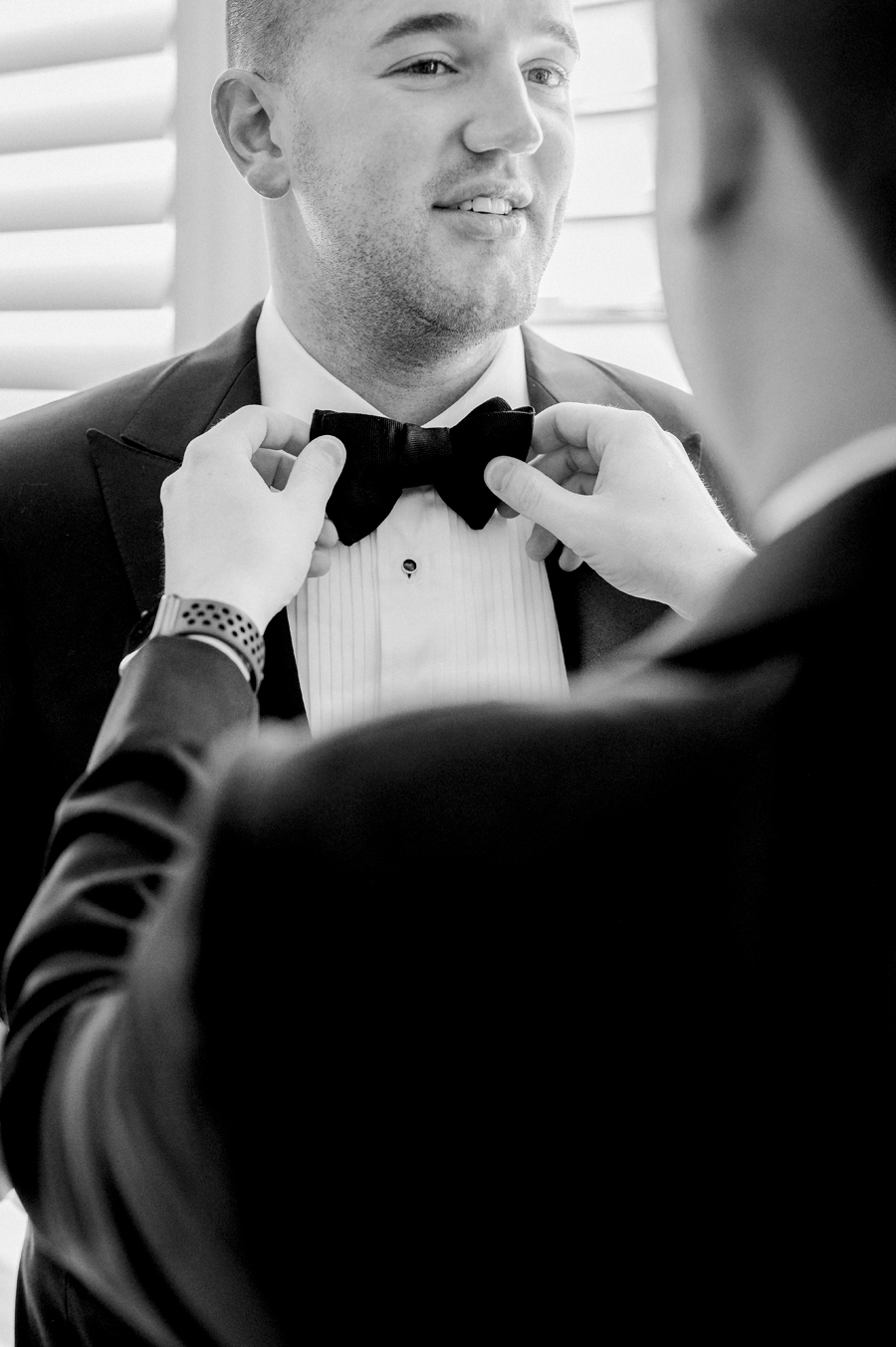 The groom getting ready for his Stephens College wedding photographed by Kansas City, Missouri wedding photographer Love Tree Studios.