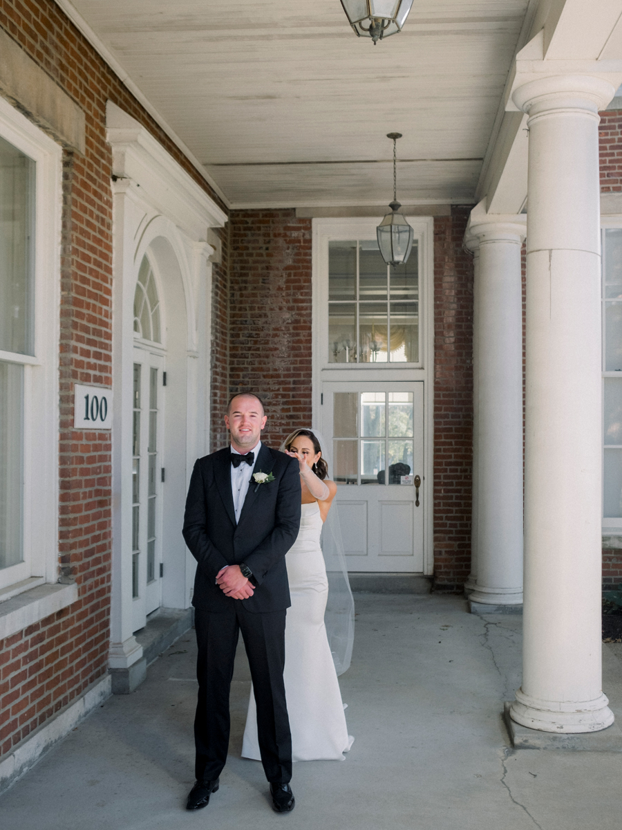 The bride and groom do a first look before their Stephens College wedding photographed by Missouri wedding photographer Love Tree Studios.